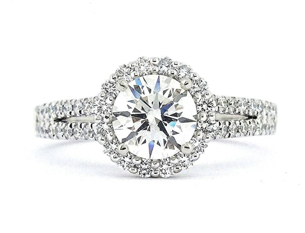 We love David & Malinda's 1.3CT Round Diamond Halo Ring