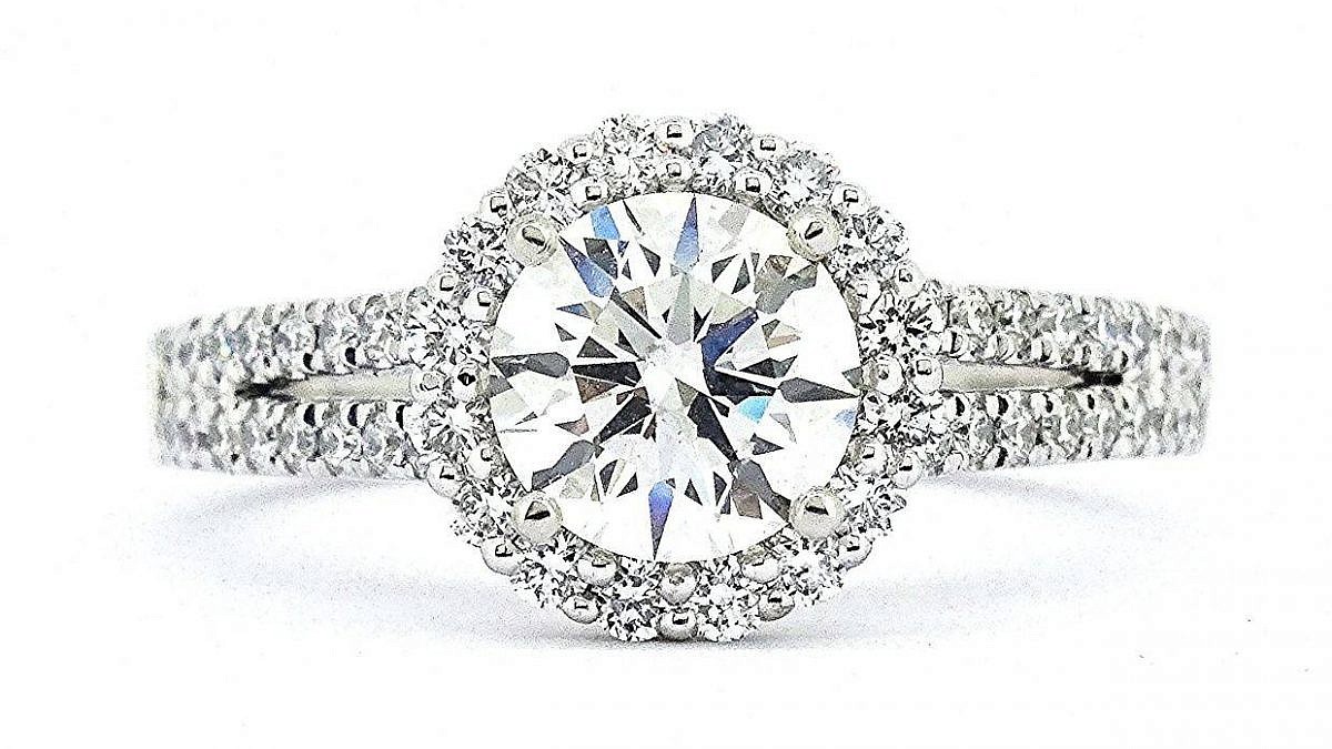 We love David & Malinda's 1.3CT Round Diamond Halo Ring