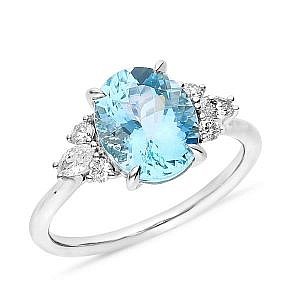 Oval cut blue topaz & side diamond ring
